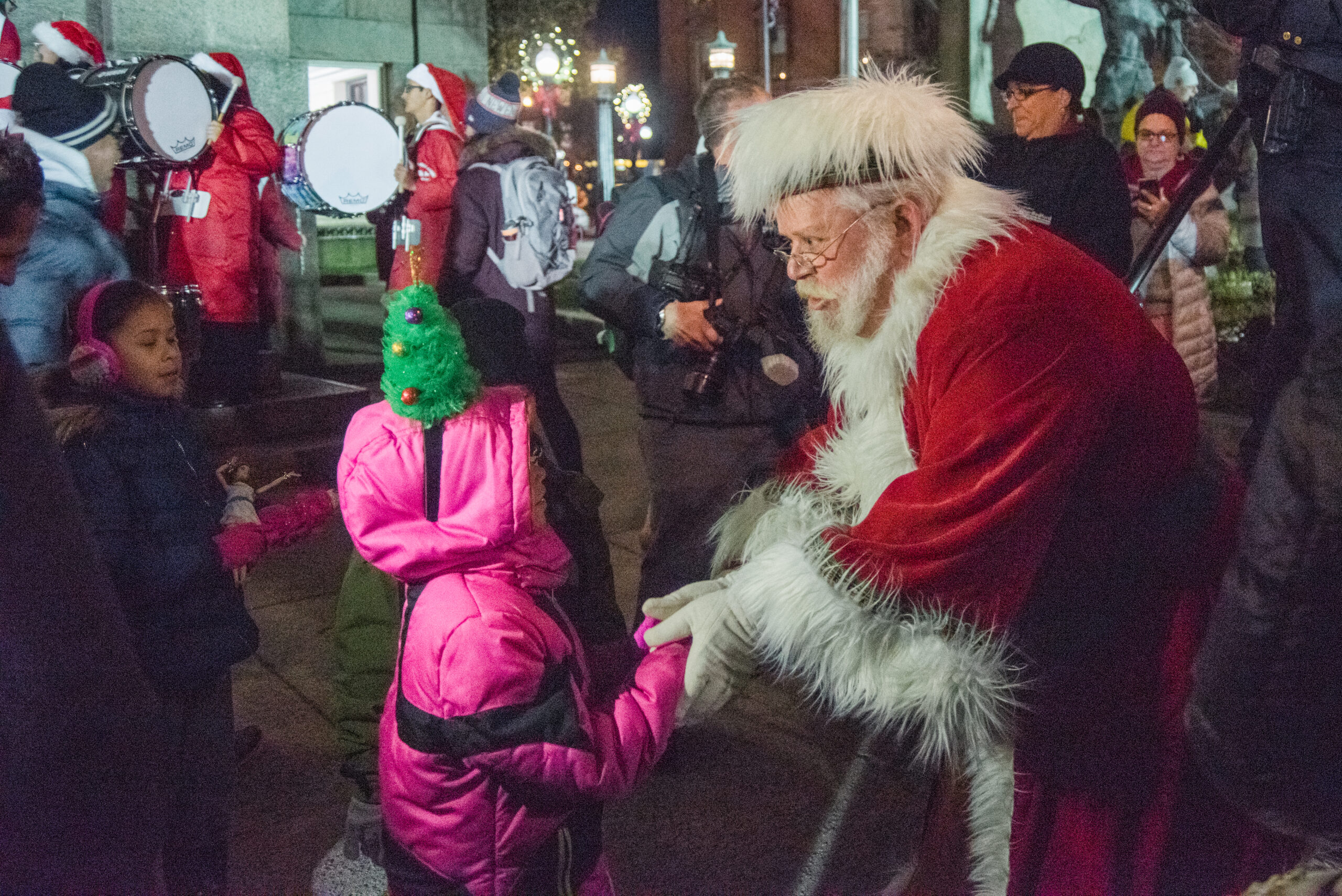 Santa Claus greets children at downtown New Bedford's Holiday Stroll